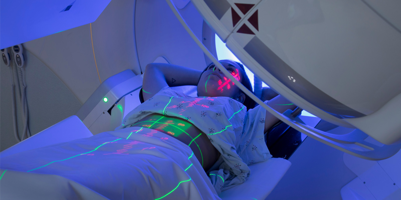 Woman receiving radiation therapy