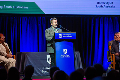 UniSA student Kane O’Brien (pictured at the lectern) was one of three students to share their research at the award ceremony.