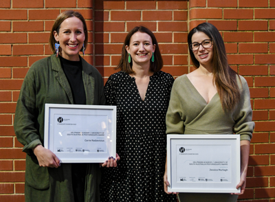 UniSA Master of Design (Contemporary Art) graduates Carrie Radzevicius (left) and Jessica Murtagh (right) with UniSA Creative General Manager Sam Goodred (centre). Photo by Jack Fenby.