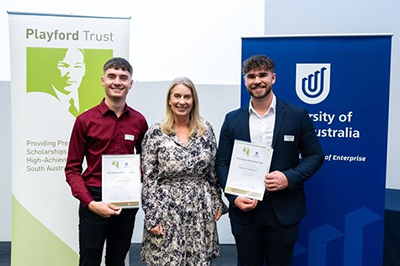 Playford Trust Scholarship recipients Caleb Ferraresso and Daniel Chalmers with UniSA Provost and Chief Academic Officer Professor Joanne Cys.