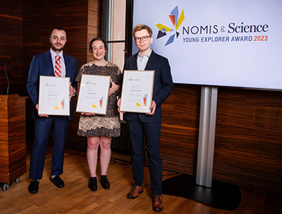 Dr Isabella Bower, flanked by two other NOMIS & Science Young Explorer Award recipients, at the Zurich presentation night.