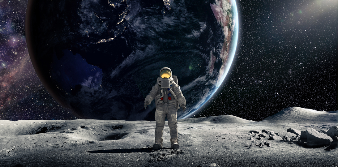 Astronaut standing on the moon looking at Earth in the distance