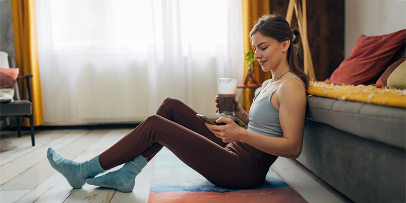 Woman drinking chocolate milk after exercising