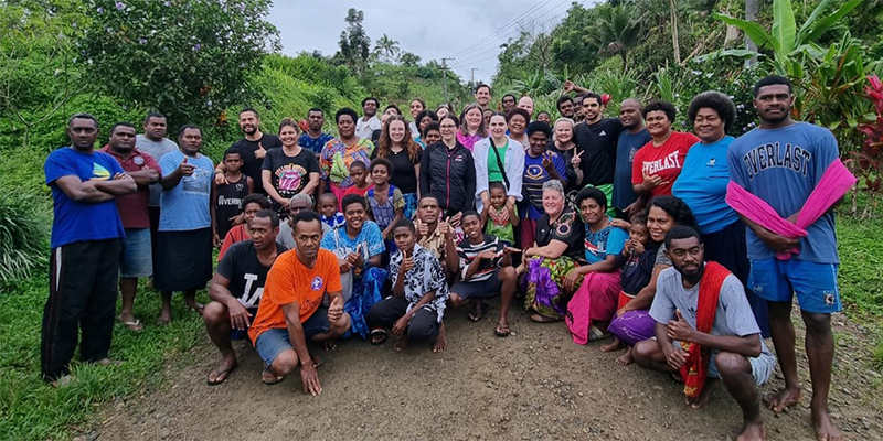 Students and staff with Nasevou Village members. 