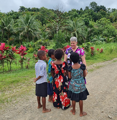 Kylie Cook with Fijian youth in the rural Nasevou Village, Naitasiri, located in the country’s southeast.