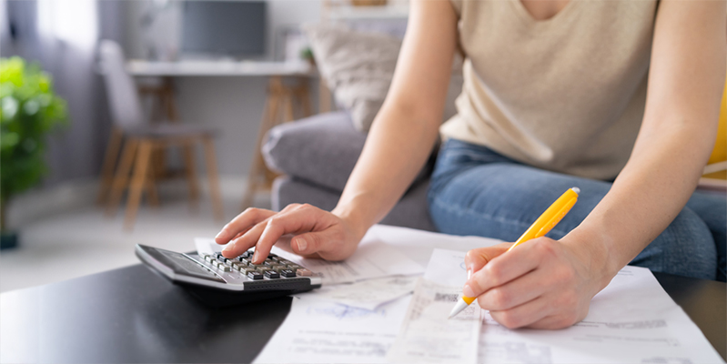 Woman sorting her finances at home